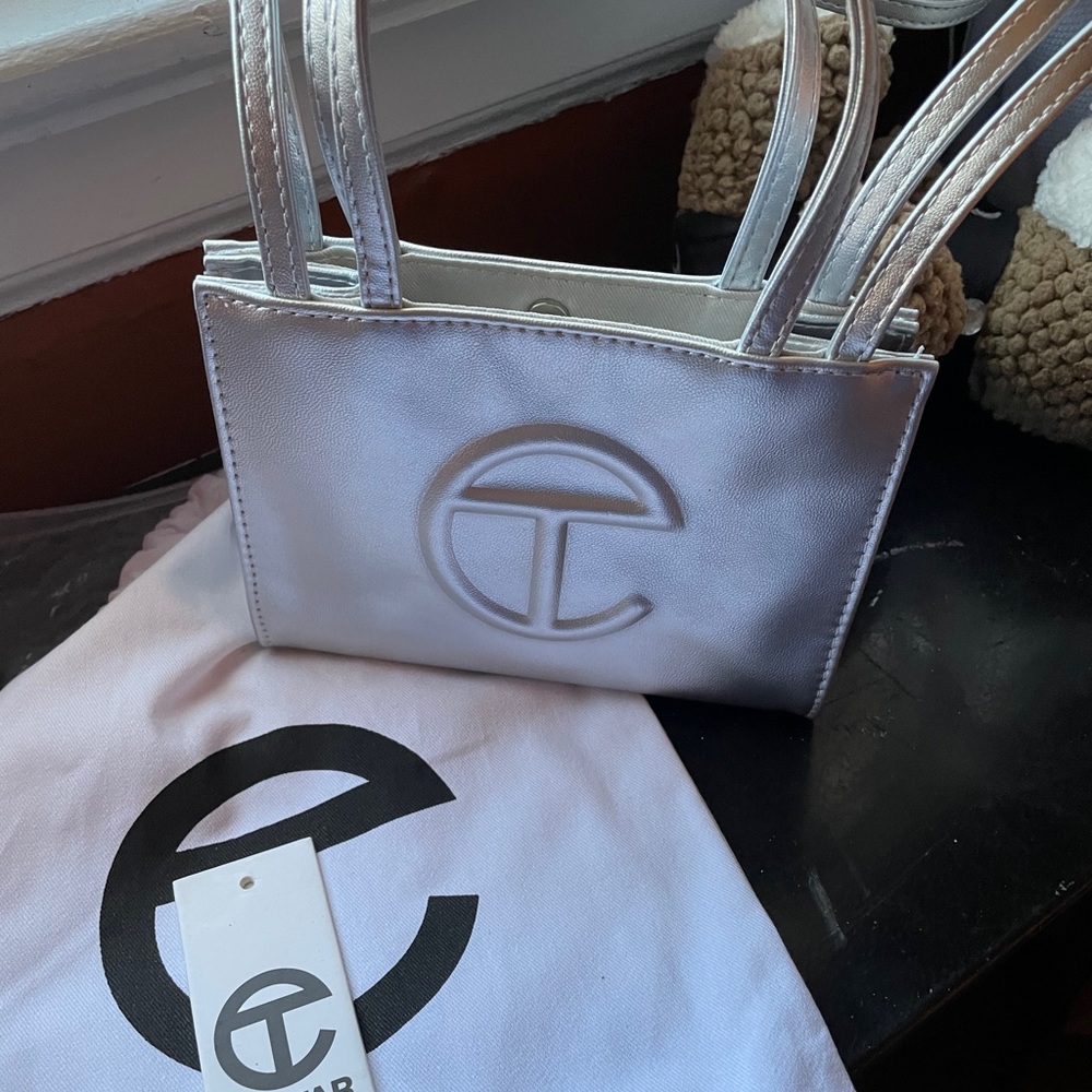 Mini Silver Telfar bag worn twice